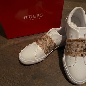 White and gold guess shoes